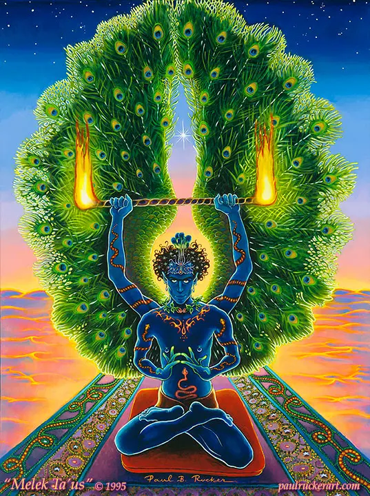 Melek Taus, a blue god with peacock wings sits on a patterned carpet.